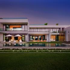 Contemporary Home Exterior With Zero-Edge Pool