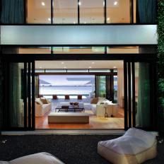 Contemporary Patio Surrounded by Lush Hedges