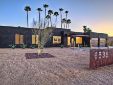 Designer Eric Spry blended modern elements, such as rusted metal panels, with Southwestern style and drought-tolerant landscaping in the entryway and pool area of this home.