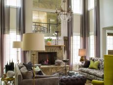 Neutral Transitional Living Room With High Ceiling & Green Accents