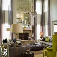 Sophisticated Living Area Features Chic Furniture & Tall Ceilings