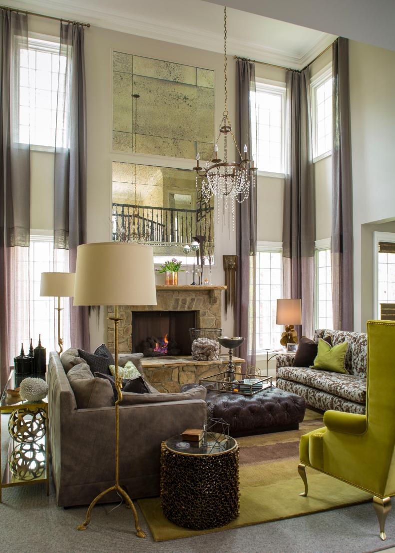 Neutral Transitional Living Room With High Ceiling & Green Accents
