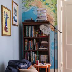 Boy's Reading Nook Features World Map Accent Wall