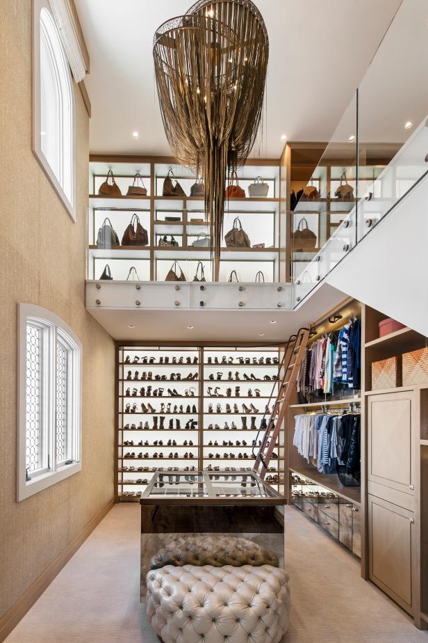 Contemporary Two-Story Walk-In Closet With Stunning Bronze Chandelier 