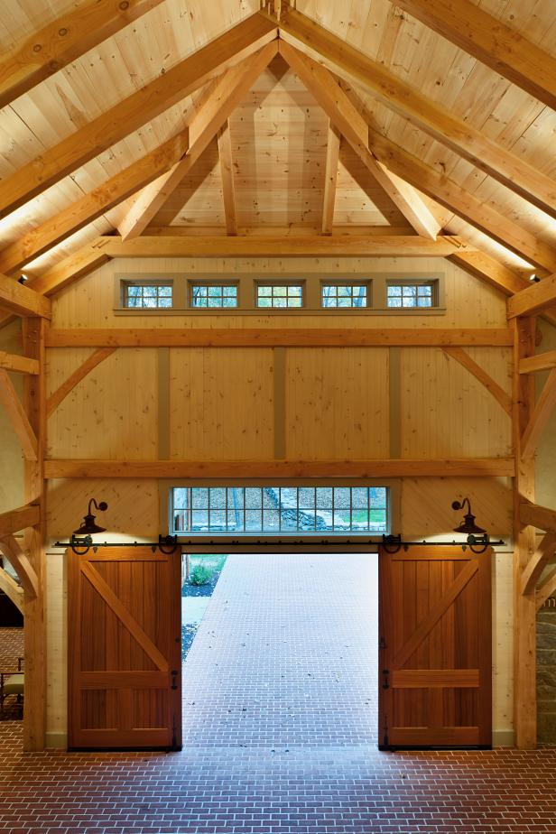 luxury garage features rustic sliding barn doors hgtv