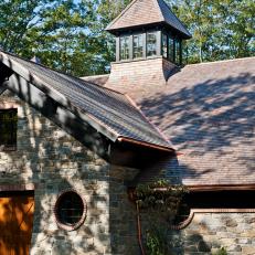 Round Windows and Cupola Add Interest to Car Barn Exterior