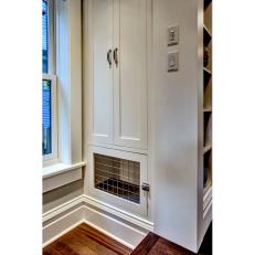 Custom Built-In Dog Crate Under Pantry Cabinets