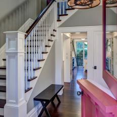 Pink Dutch Front Door Opens Into Gray Transitional Foyer