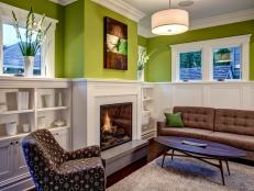 Green Transitional Family Room With Fireplace and Brown Sofa
