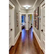 Hallway With Hardwood Floor, Gray Walls and White Trim