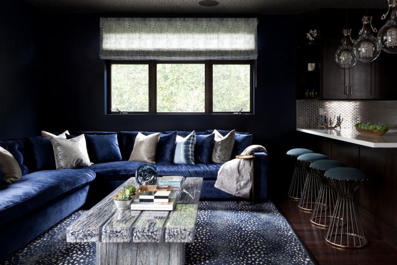 Contemporary Living Room With Blue Sofa and Spotted Rug