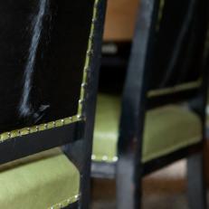 Detail of Black Wood Chairs With Faux Fur Back & Green Upholstery