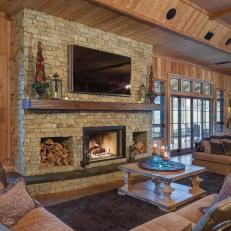 Spacious, Rustic Living Room With Stone Fireplace Surround