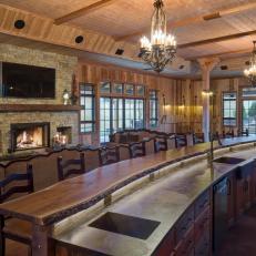 Long Bar With Wood Barstools in Rustic Great Room