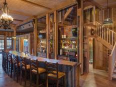 Rustic Bar With Long Wood Countertop & Wooden Barstools
