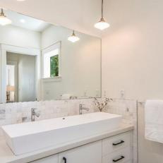 Creamy White Bathroom With Trough-Like Vessel Sink