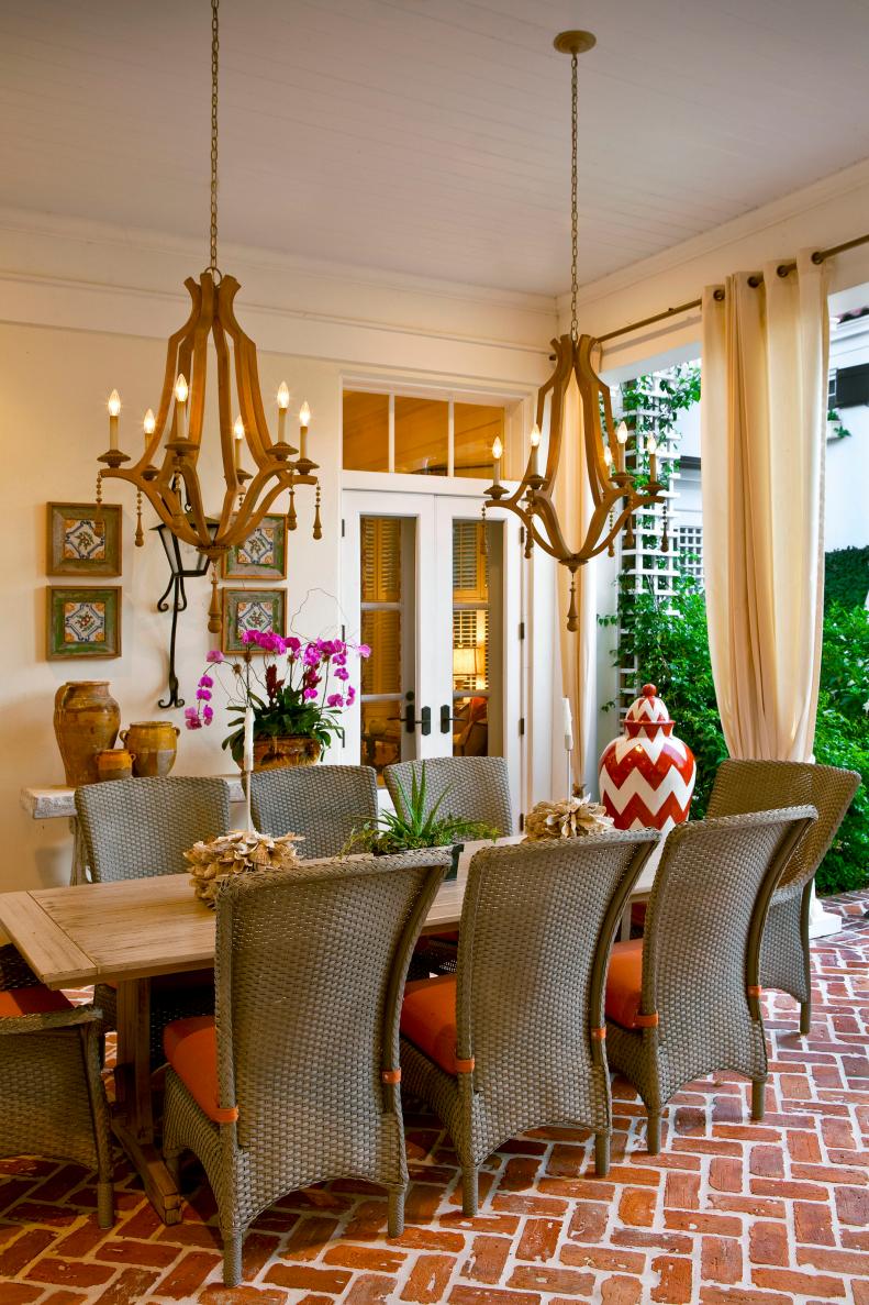 Outdoor Dining Room With Wicker Chairs & Wood Chandeliers