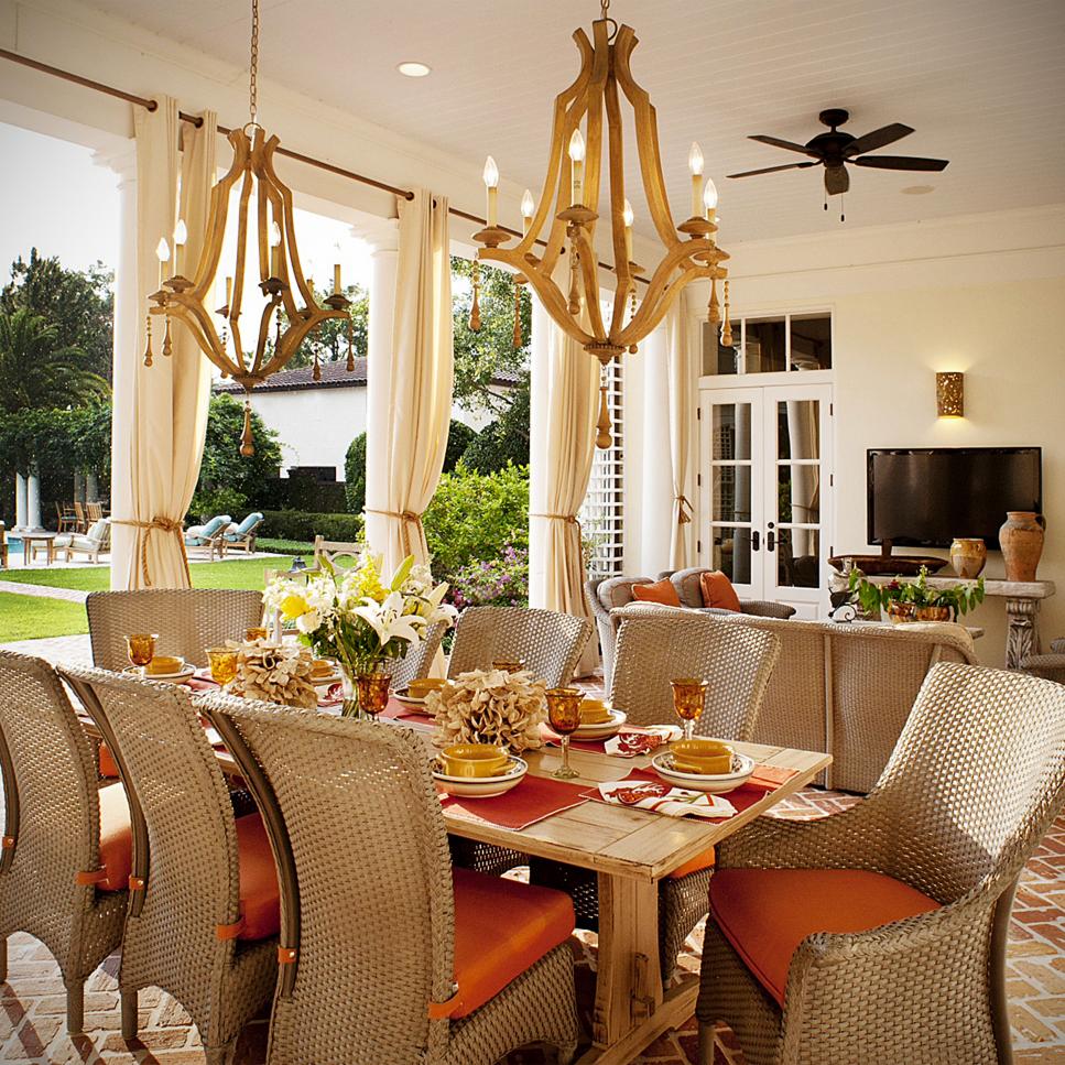 Outdoor Dining Area With Two Wood Chandeliers