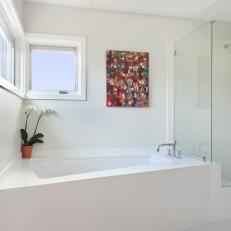 White Soaking Tub and Painting