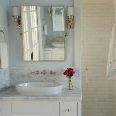 Master Suite Vanity and Shower With Marble and Chrome Finishes