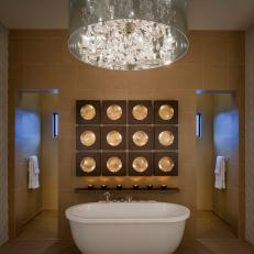 Master Bath with Glass and Crystal Chandelier Plus Gold-toned and Wood Artwork