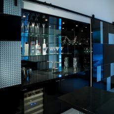 Contemporary Home Bar Enclosed by Glossy Cabinetry