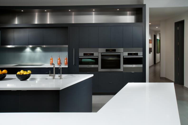 Modern Kitchen With Black Cabinets and White Countertops