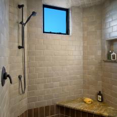 Spacious Shower With Window and Neutral Tiles