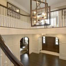 Staircase Offers View of Foyer With Custom Woodwork