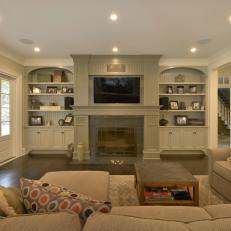 Cozy Family Room Features Lovely Gray Built-Ins