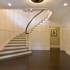 Traditional White Foyer Boasts Grand Staircase
