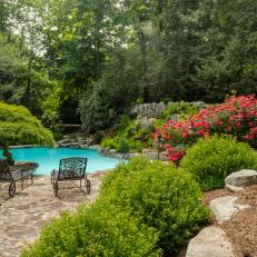 Traditional Landscaped Pool at Tudor-Style Home