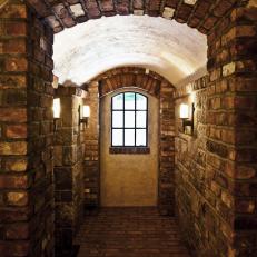Brick Hallway in Tudor-Style Basement