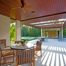 Patio of a Modern Home Featuring Wood Ceilings, Fireplace and Multiple Seating Areas