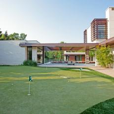 Modern Wood and Concrete Home with Putting Green
