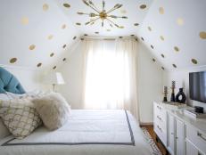 White Bedroom With White Furniture and Gold Polka Dots on the Ceiling