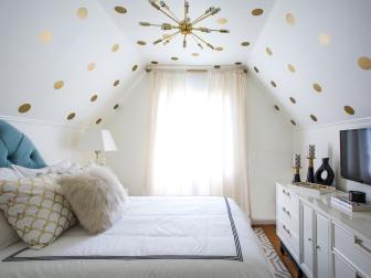 White Bedroom With White Furniture and Gold Polka Dots on the Ceiling