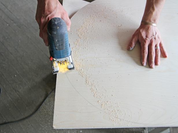Cut plywood using a jigsaw.