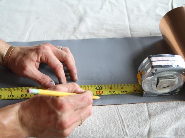 Measure and mark eight feet of copper flashing with a pencil