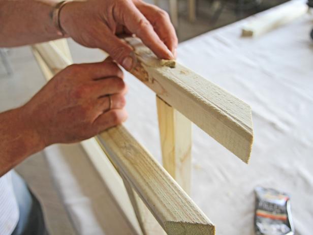 Fill holes in wood legs with wood filler.