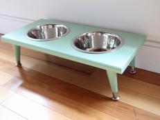 Make your favorite pooch a pet feeding station using a wooden stair tread.