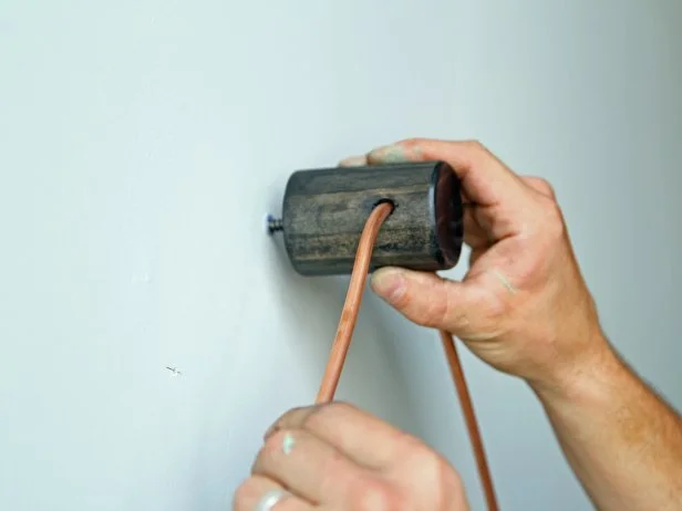 Install the piece on the wall by twisting the dowel screw into a stud or a drywall anchor.