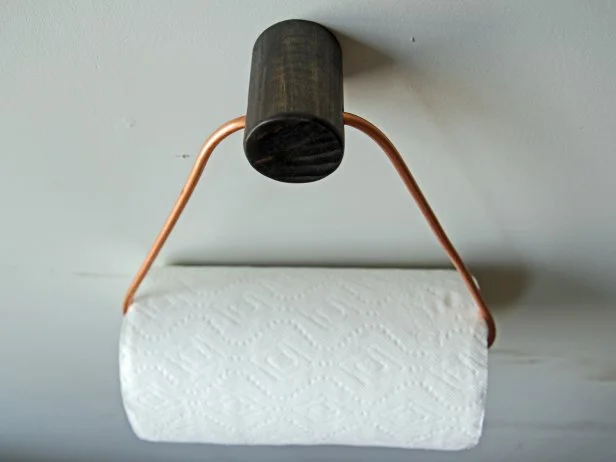 Add a stylish touch to your kitchen with a DIY copper paper towel holder.