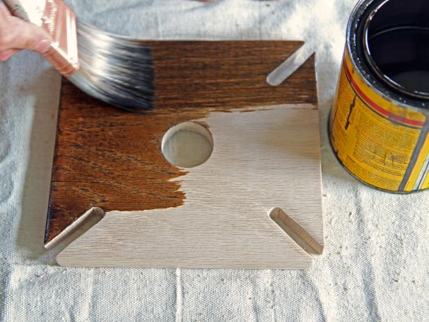 Stain the wood piece using a dark walnut stain.