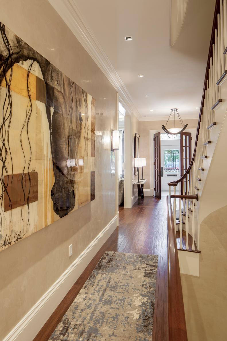 Neutral, Transitional Hallway With Art