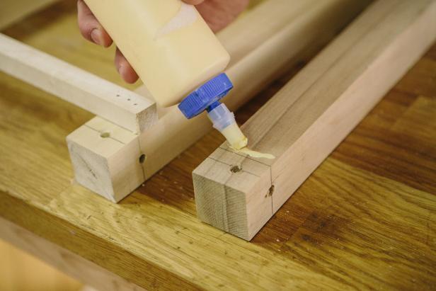 Apply wood glue to table legs before attaching braces.