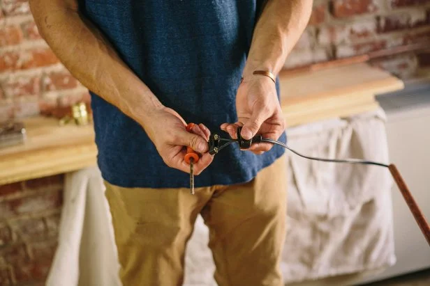 Assemble plug at end of copper piping to make an industrial-style sconce.