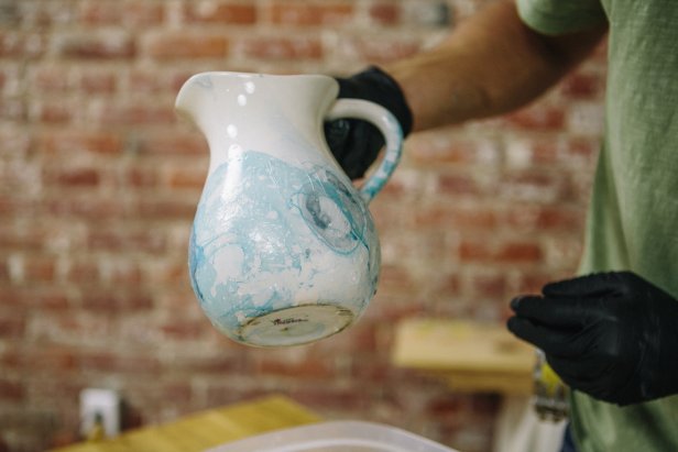 Create a marbling effect on vases using nail polish.