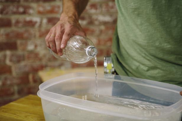 Add water to an empty container.