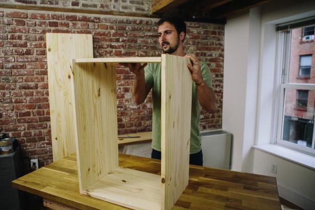Assemble cabinet frame using wood glue and a nail gun